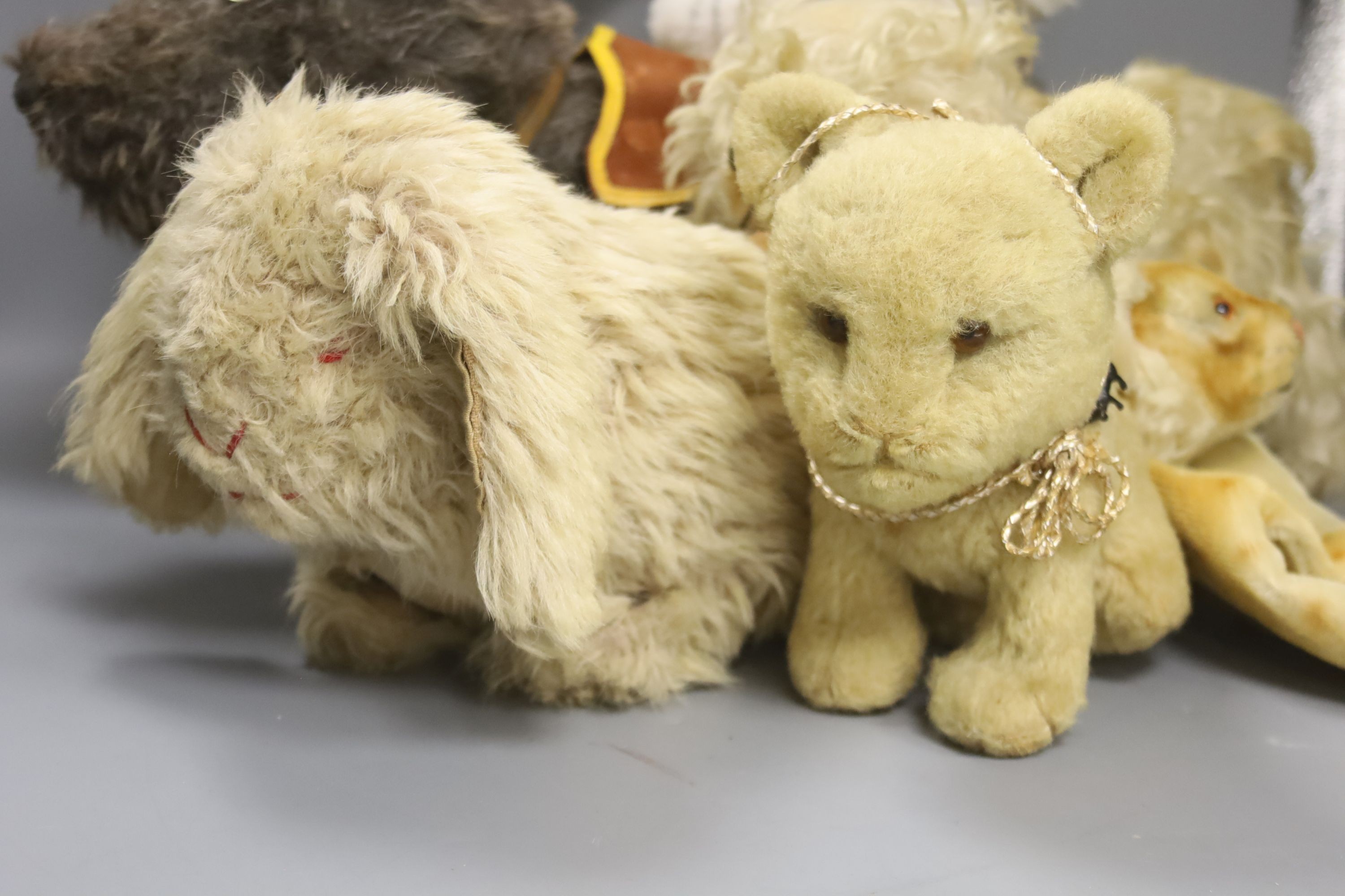 A collection of five various soft toy animals